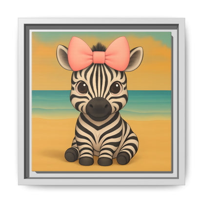 Cute baby zebra wall art with big pink bow sitting on sandy beach background in black frame