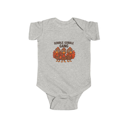 Ash gray baby seasonal onesie with 'Gobble Gobble Gang' text and turkey graphics on a white background.