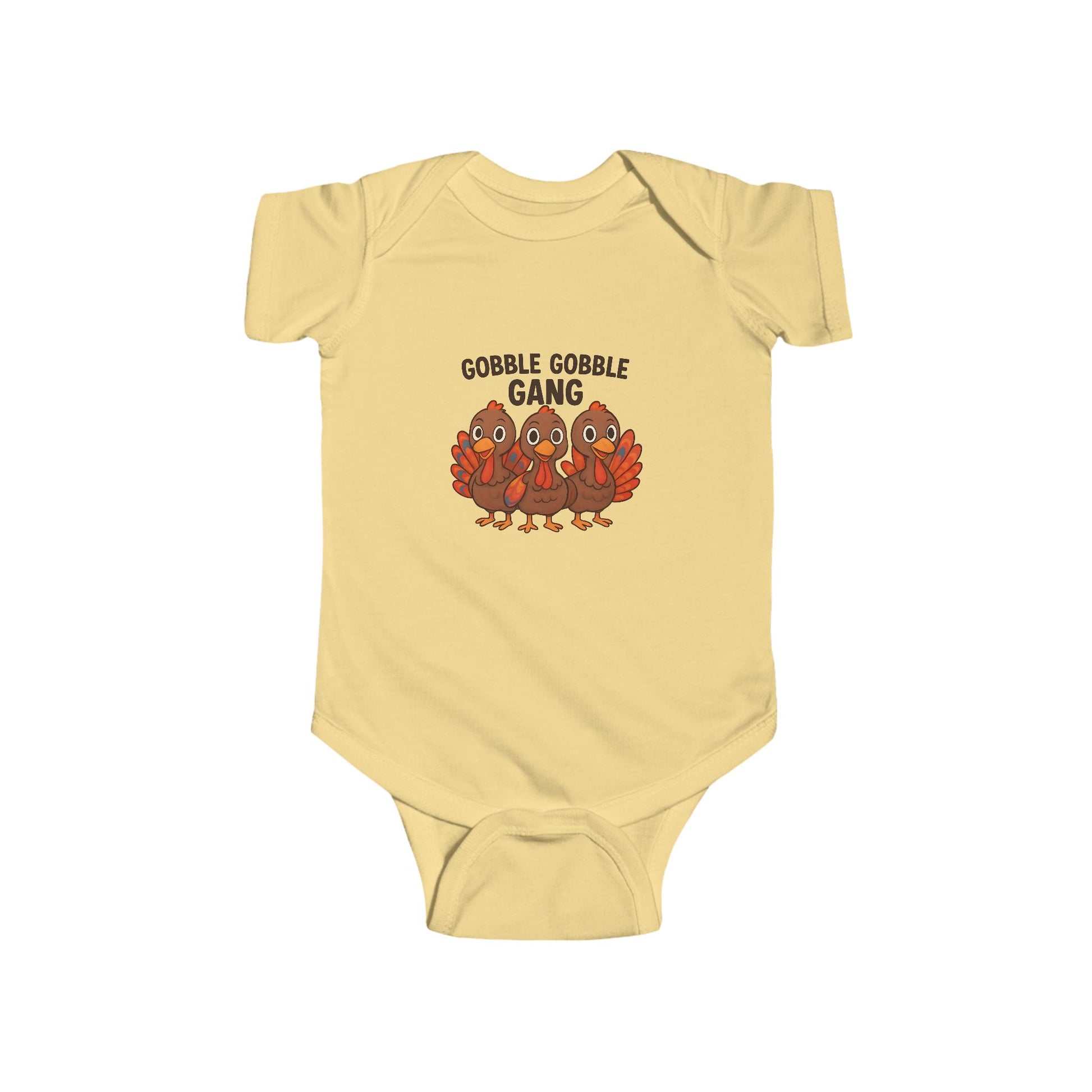 Yellow baby onesie with 'Gobble Gobble Gang' text and turkey graphics on a white background
