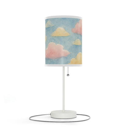 Table lamp with a cloud-patterned shade on a white background