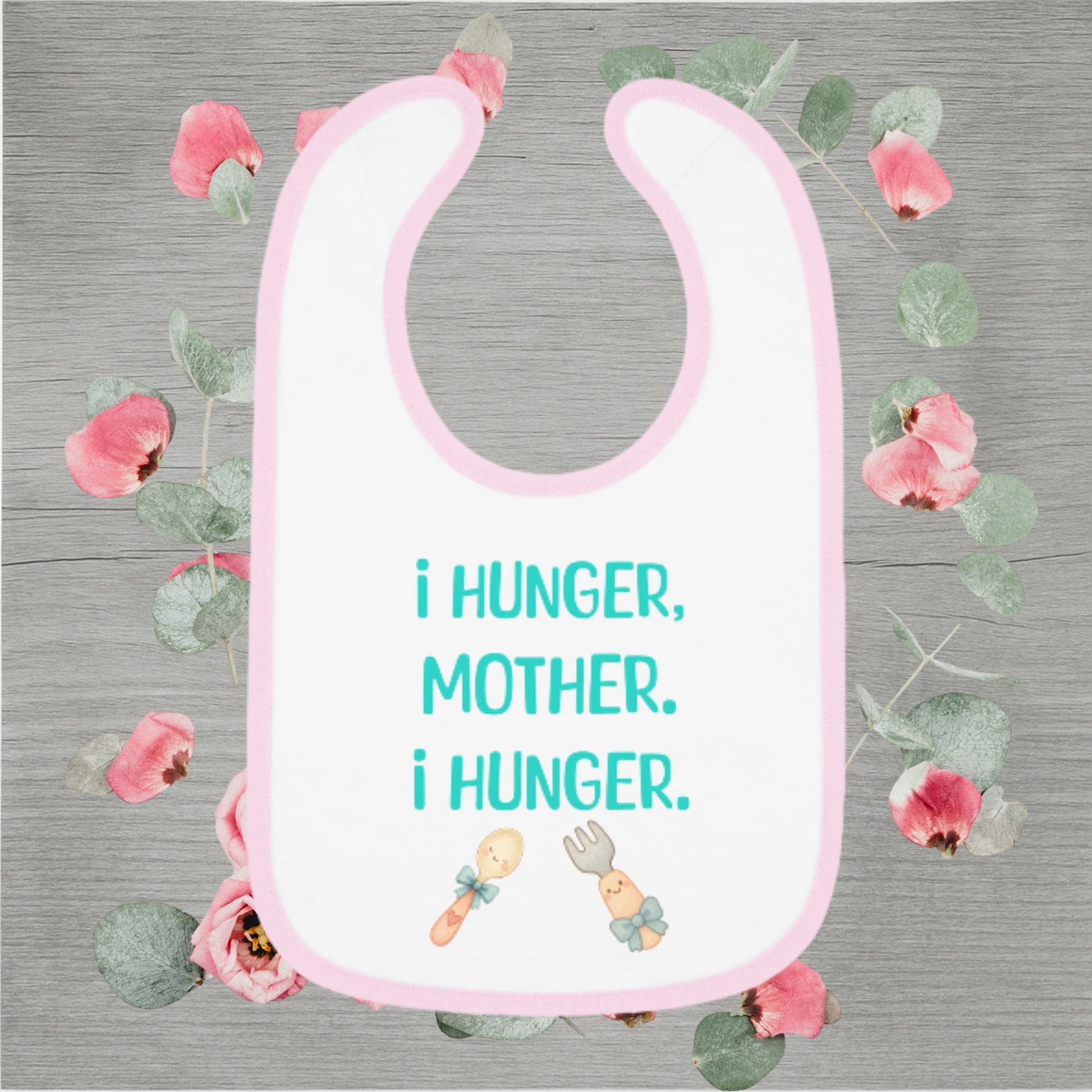 Funny baby bib with pastel pink trim and the quote 'I Hunger, Mother. I Hunger.' printed in teal with cute fork and spoon illustrations.