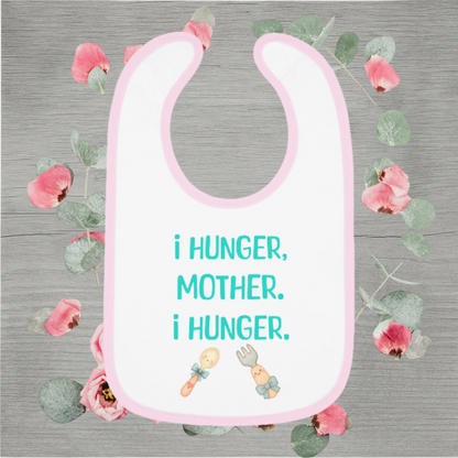 Funny baby bib with pastel pink trim and the quote 'I Hunger, Mother. I Hunger.' printed in teal with cute fork and spoon illustrations.