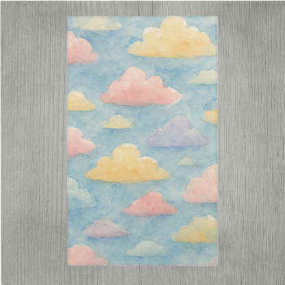Watercolor nursery rug featuring dreamy clouds and hemmed edges for added durability