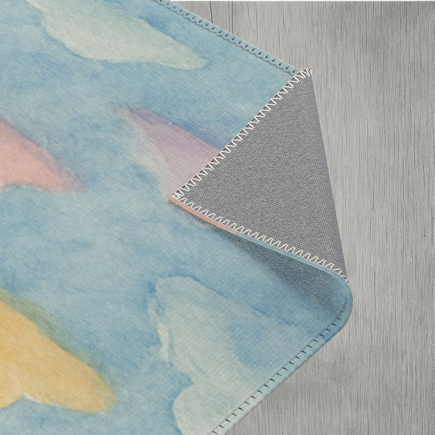 Soft polyester area rug with pastel rainbow clouds ideal for kids rooms and play areas