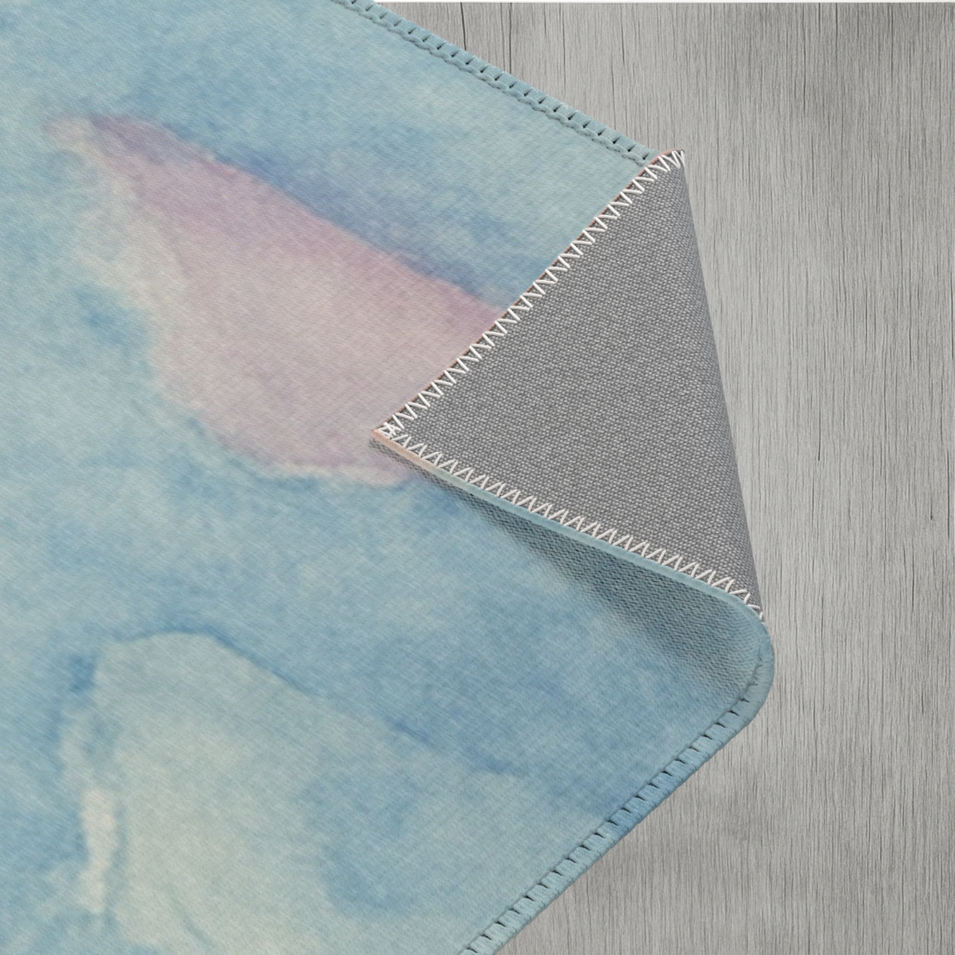 Vibrant cloud watercolor rug for bedrooms and nurseries with fade-resistant printing and soft texture