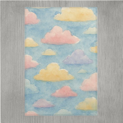 Pastel rainbow watercolor cloud area rug with vibrant soft colors and hemmed edges for durability, designed for modern home décor.