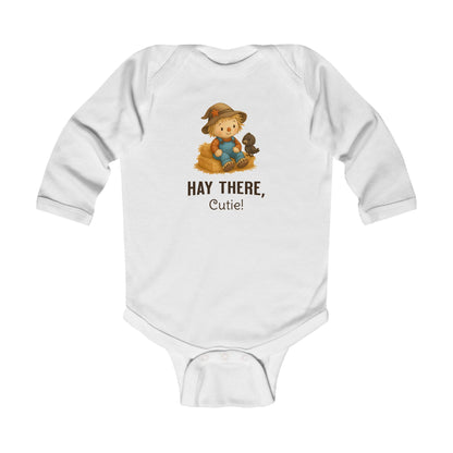 White scarecrow baby onesie long sleeve with a crow illustration perfect for autumn